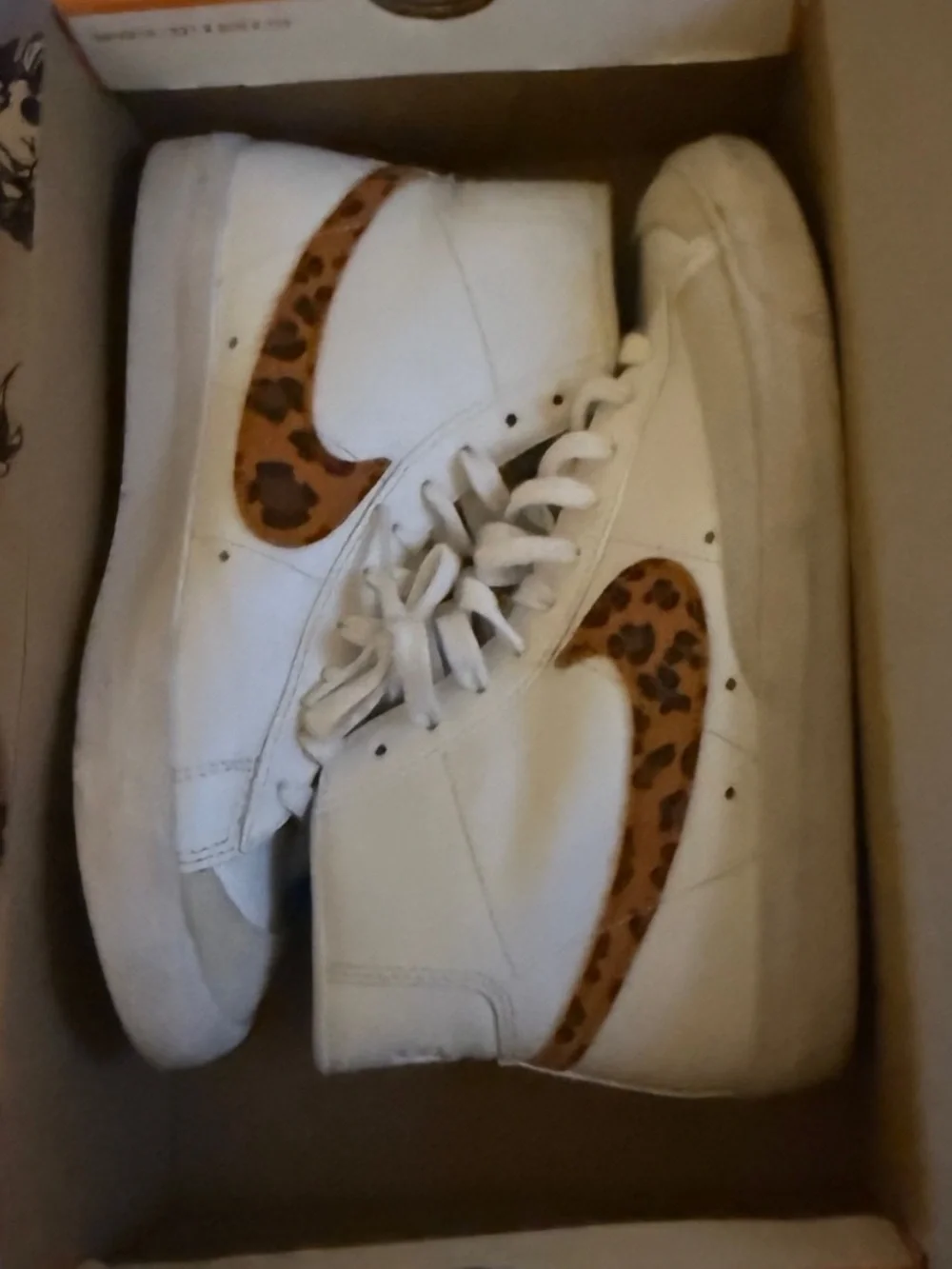 Nike White High-Top Sneakers with Leopard-Print Swoosh